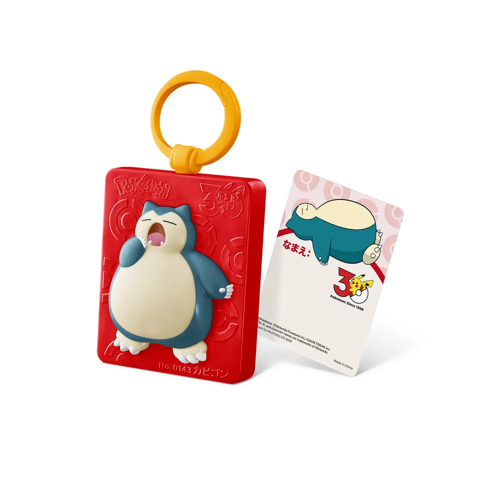 The Snorlax Travel Name Tag next to its included name card, both shown against a white background